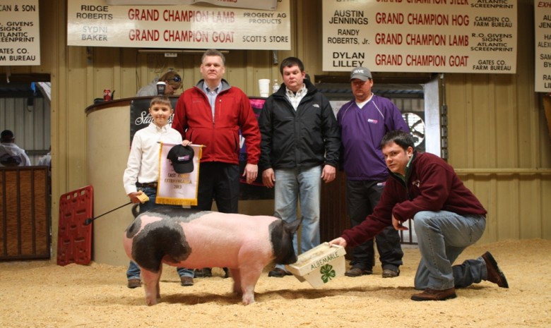 The Clark Family of Gretna, VA with the Champion Heavy Weight Pig and Reserve Champion Overall Pig at the 2013 East Coast Extravaganza