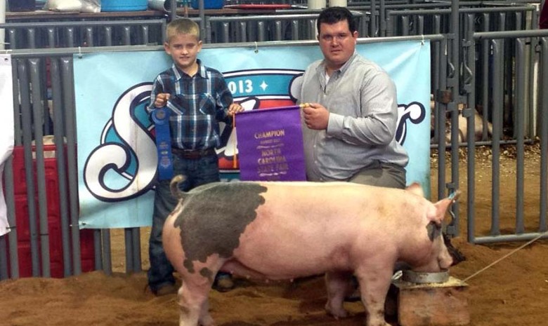 Logan Gentry with the Grand Champion Market Gilt at the 2013 North Carolina State Fair Open Show