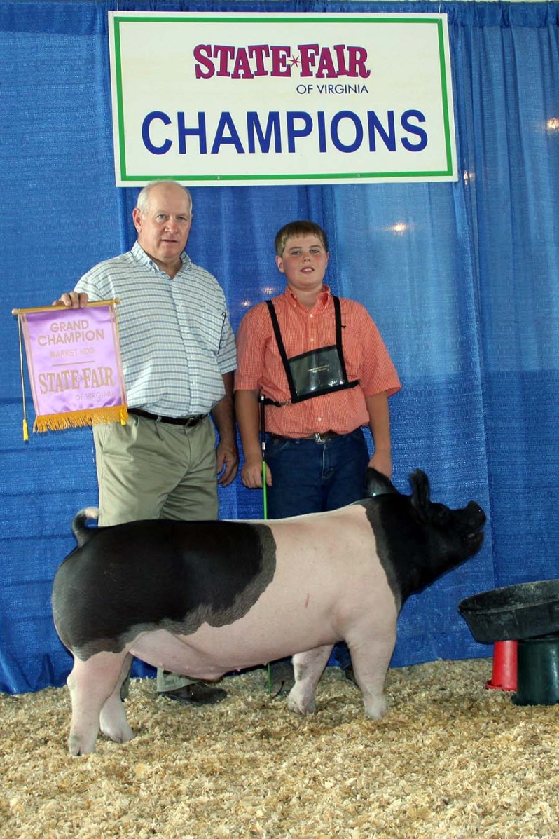 Zach McCall with the Grand Champion Market Hog at the 2013 Virginia State Fair