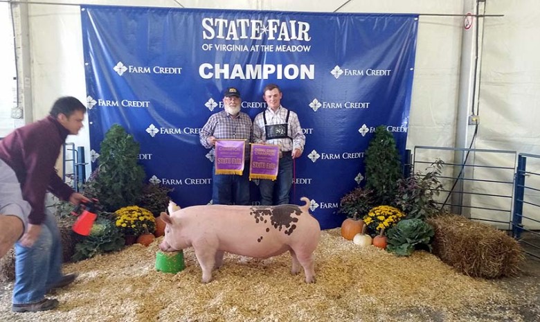 The Nixon Family with the Grand Champion Barrow Overall at the 2014 Virginia State Fair