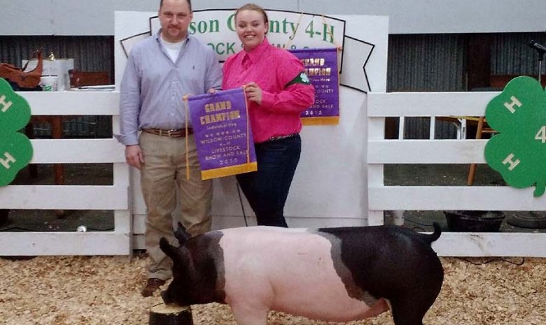 Hunter Meacomes with the Grand Champion at the 2015 Wilson County, NC 4-H Livestock Show