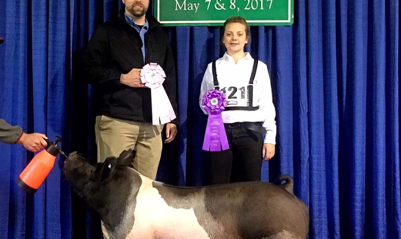 Riley Hines with the Grand Champion at the 2017 Fauquier  4-H Livestock Show