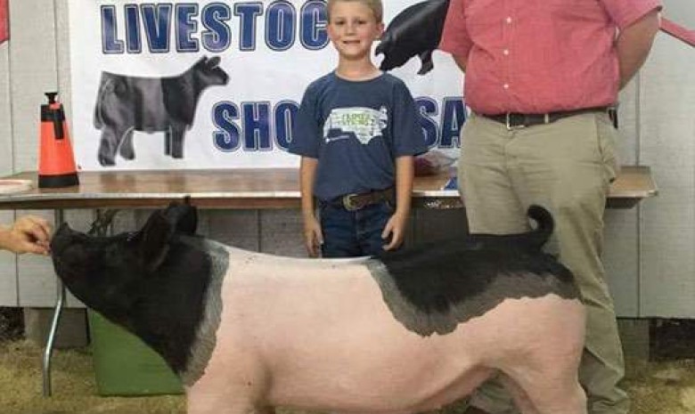 Ashton Seal with the Grand Champion at the 2017 Northwest, NC Junior Livestock Show