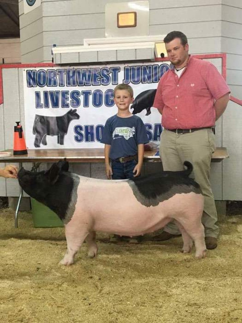 Ashton Seal with the Grand Champion at the 2017 Northwest, NC Junior Livestock Show