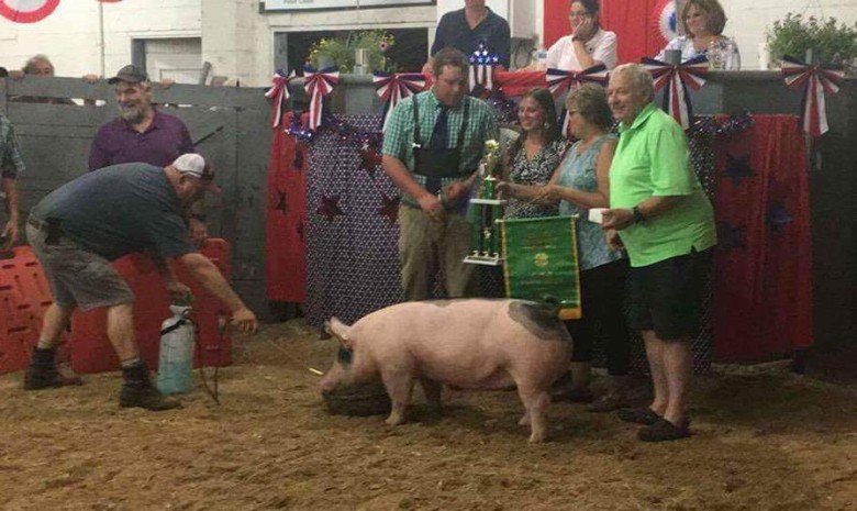 D. J. Dyer with the Grand Champion at the 2017 CMR Farm Show