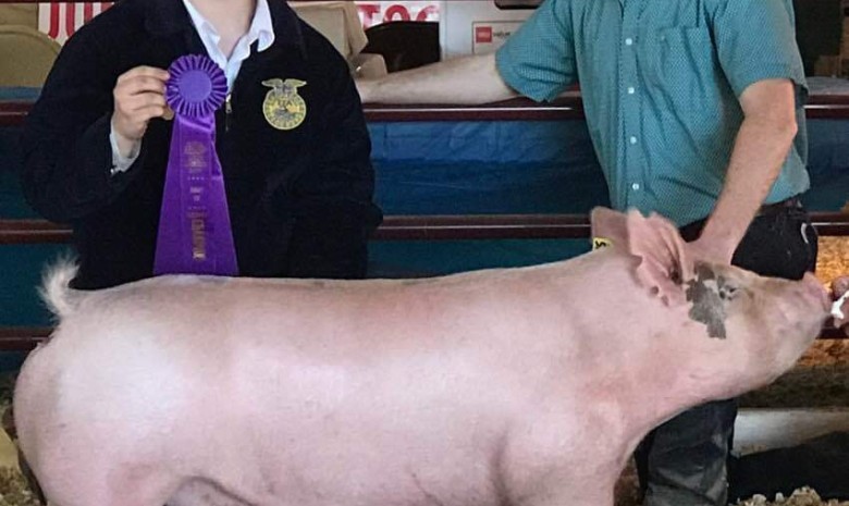 Gray Palmer with the Champion at the 2019 Central Piedmont Junior Livestock Show