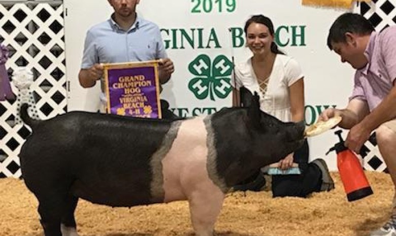 Camille Mitchel with the Grand Champion at the 2019 Virginia Beach, VA 4-H Livestock Show