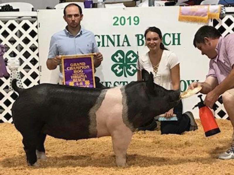 Camille Mitchel with the Grand Champion at the 2019 Virginia Beach, VA 4-H Livestock Show