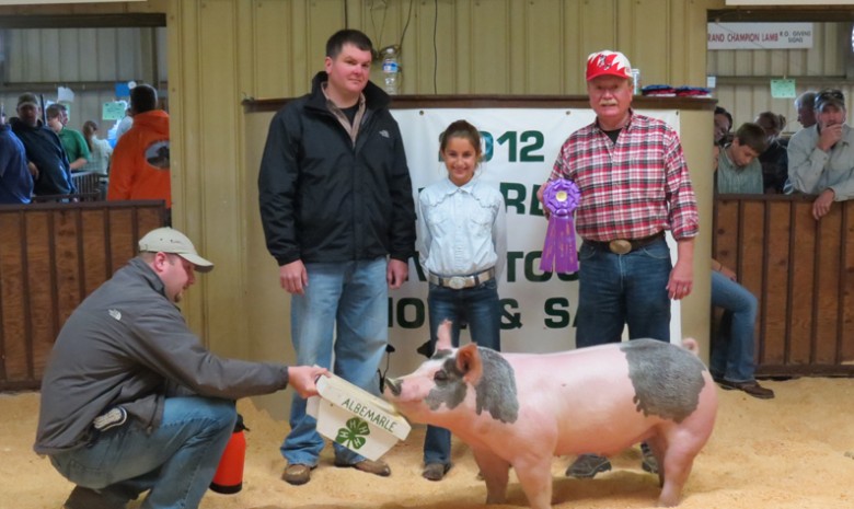 Logan Jennings with the 2012 Grand Champion Albemarle 4-H Livestock Show