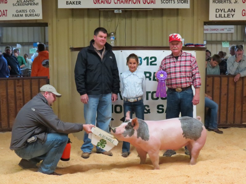 Logan Jennings with the 2012 Grand Champion Albemarle 4-H Livestock Show