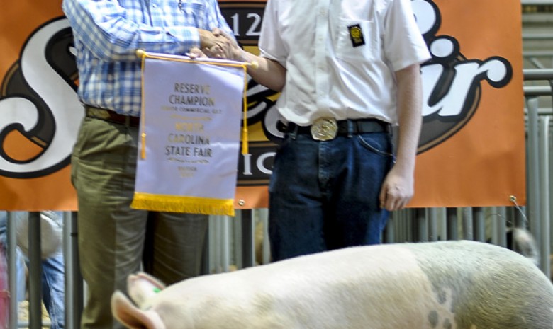 Jacob Sauls with the 2012 Reserve Champion Commercial Gilt Jr. Div. at the NC State Fair