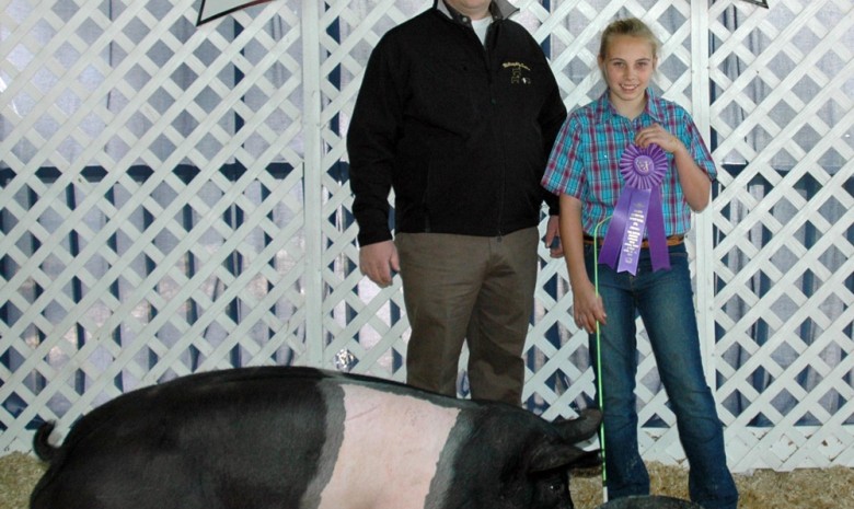 Kate Starnes with the 2012 Grand Champion at the Eastern Carolina 4-H Livestock Show