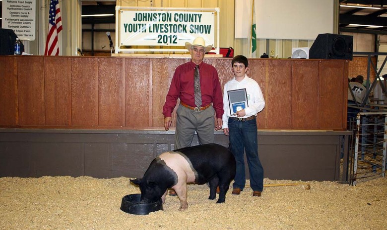 Jacob Whaley with the Grand Champion Market Hog at the 2012 Johnston County, VA Youth Livestock Show & Sale