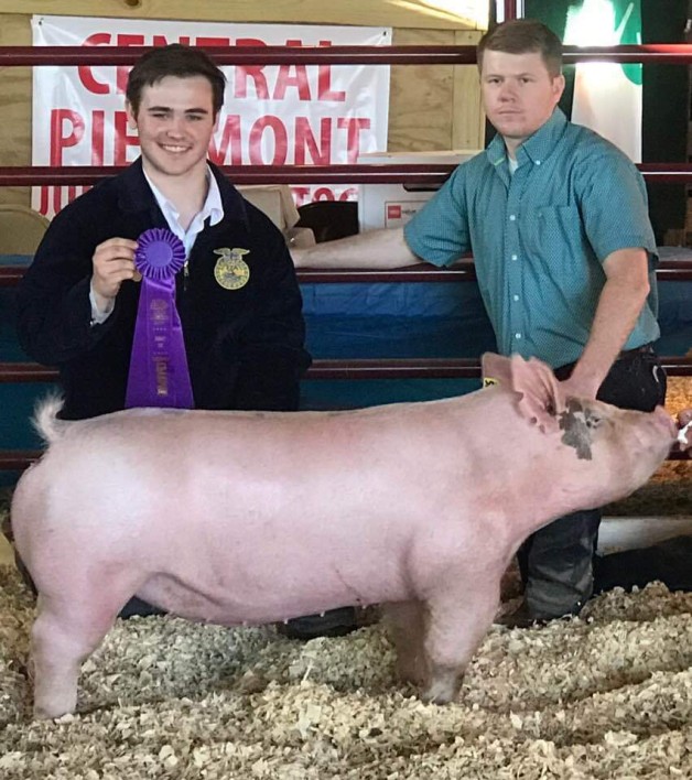 Gray Palmer with the Champion at the 2019 Central Piedmont Junior Livestock Show