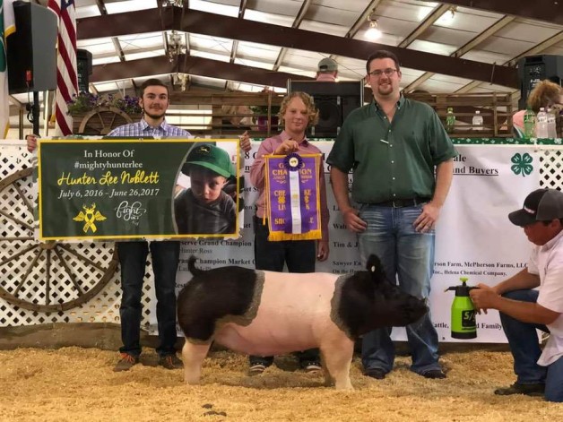 Hunter Ross with the Grand Champion at the 2019 Chesapeake, VA 4-H Livestock Show