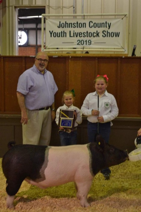 Kaylee Pittman with the Grand Champion at the 2019 Johnston County, NC Livestock Show