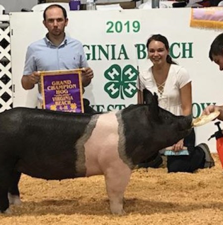 Camille Mitchel with the Grand Champion at the 2019 Virginia Beach, VA 4-H Livestock Show