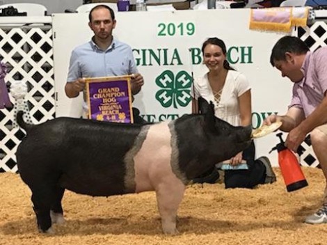 Camille Mitchel with the Grand Champion at the 2019 Virginia Beach, VA 4-H Livestock Show
