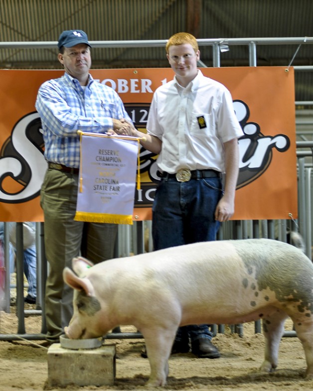 Jacob Sauls with the 2012 Reserve Champion Commercial Gilt Jr. Div. at the NC State Fair