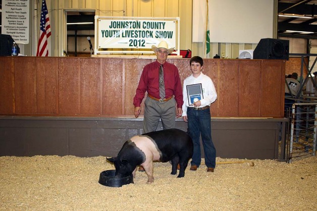 Jacob Whaley with the Grand Champion Market Hog at the 2012 Johnston County, VA Youth Livestock Show & Sale