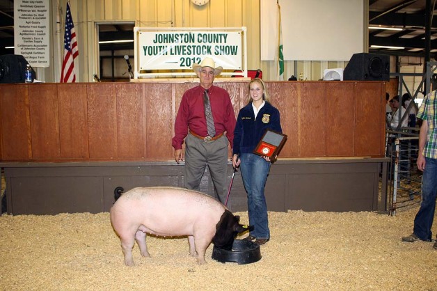 Meghan Watson with the Reserve Champion Market Hog at the 2012 Johnston County, VA Youth Livestock Show & Sale